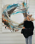 Lotta Sirén in front of "Gone with the Wind" abstract artwork