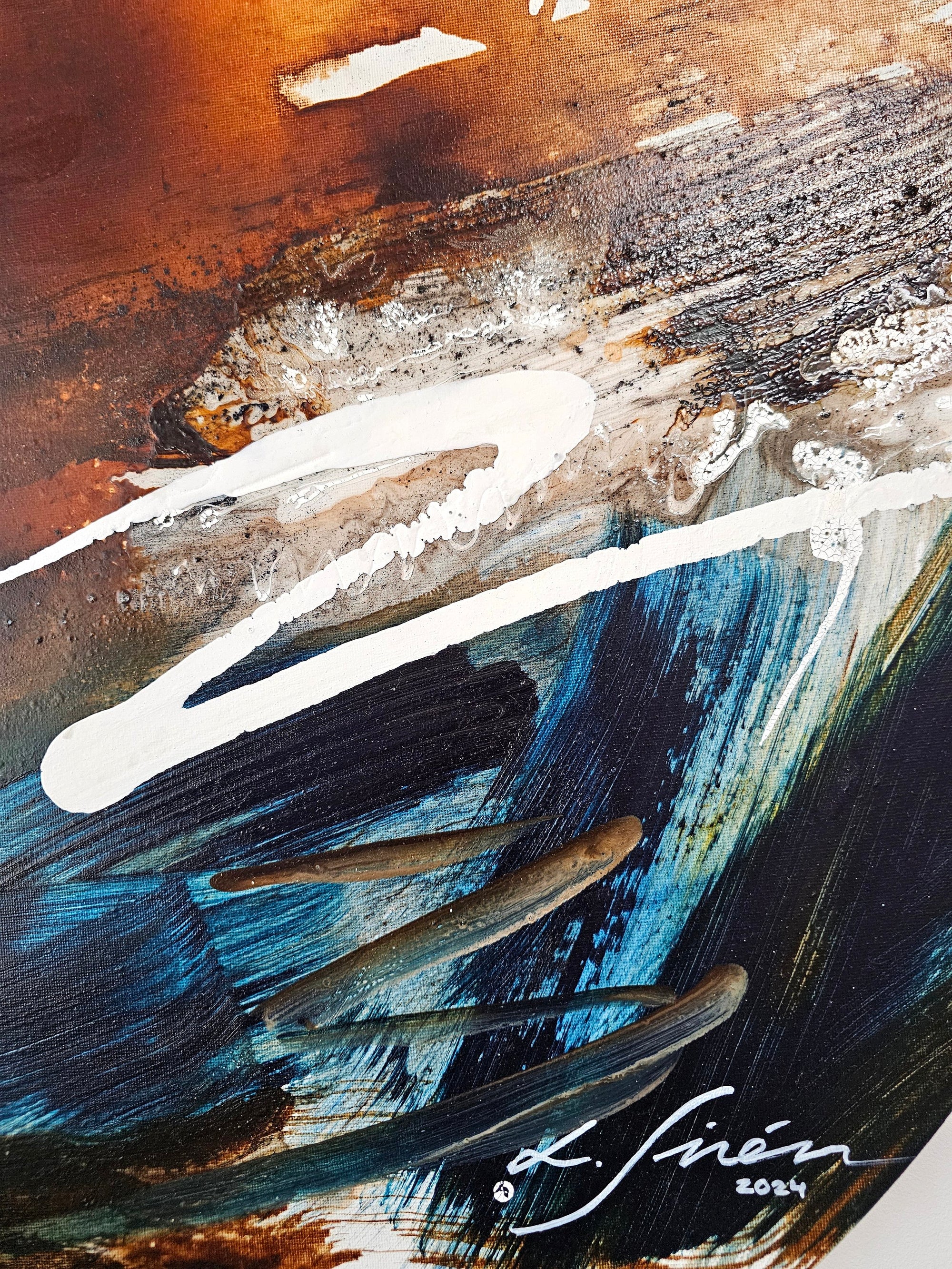 Close-up on blue and orange abstract paitning.