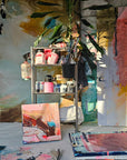 Lotta Sirén's art studio with various paintings and art supplies