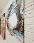 "Gone with the Wind" abstract painting on a white wall with wooden ceiling