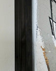 Close-up of an empowering abstract painting by Lotta Sirén with black frame.