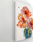 A semi-abstract floral painting on a white wall pictured from the side