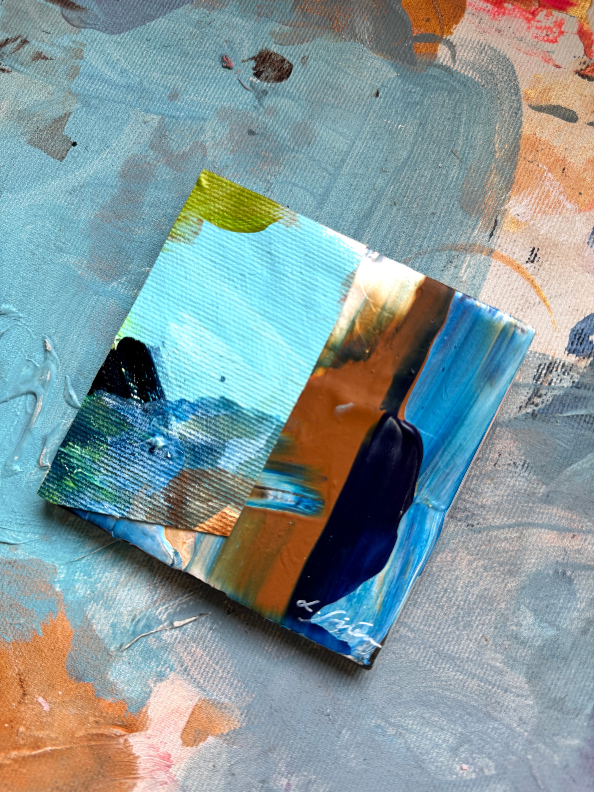 A ceramic abstract painting with a textured details on a colourful background