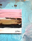 Abstract painting with pink, brown, and blue strokes on a textured surface.
