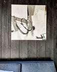 Empowering abstract artwork by Lotta Sirén on a black wooden wall.