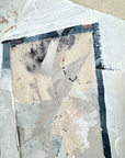 Abstract art piece with textured surface and color variations
