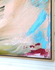 Colorful abstract painting with signature by Finnish emerging artist Lotta Sirén on a white wall. Oak floater frame.
