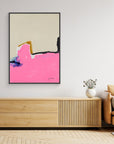 NO MATTER - Limited Edition Canvas Print with beige, bright pink and blue, black and ocher details. Structured minimal abstract canvas print with black frames on a wall above a TV stand.