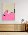 NO MATTER - Limited Edition Canvas Print with beige, bright pink and blue, black and ocher details. Structured minimal abstract canvas print with oak frames on a wall above a TV stand.