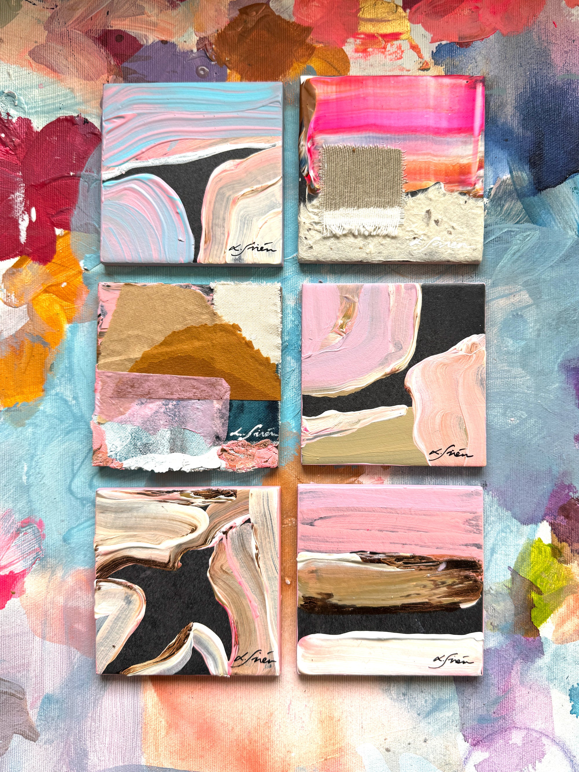Collage of ceramic abstract art pieces with colorful brush strokes on a textured background.