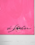 Close-up of a Lotta Sirén signature on a pink textured surface