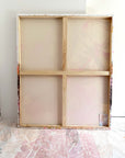 Wooden picture frame of a semi-abstract painting leaning against the wall