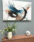 Abstract artwork by Lotta Sirén on a blue wall