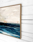 Abstract painting with blue and beige tones on a white wall by Finnish abstract artist Lotta Sirén