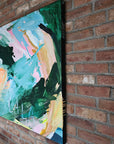 Abstract painting on a brick wall by Lotta Sirén