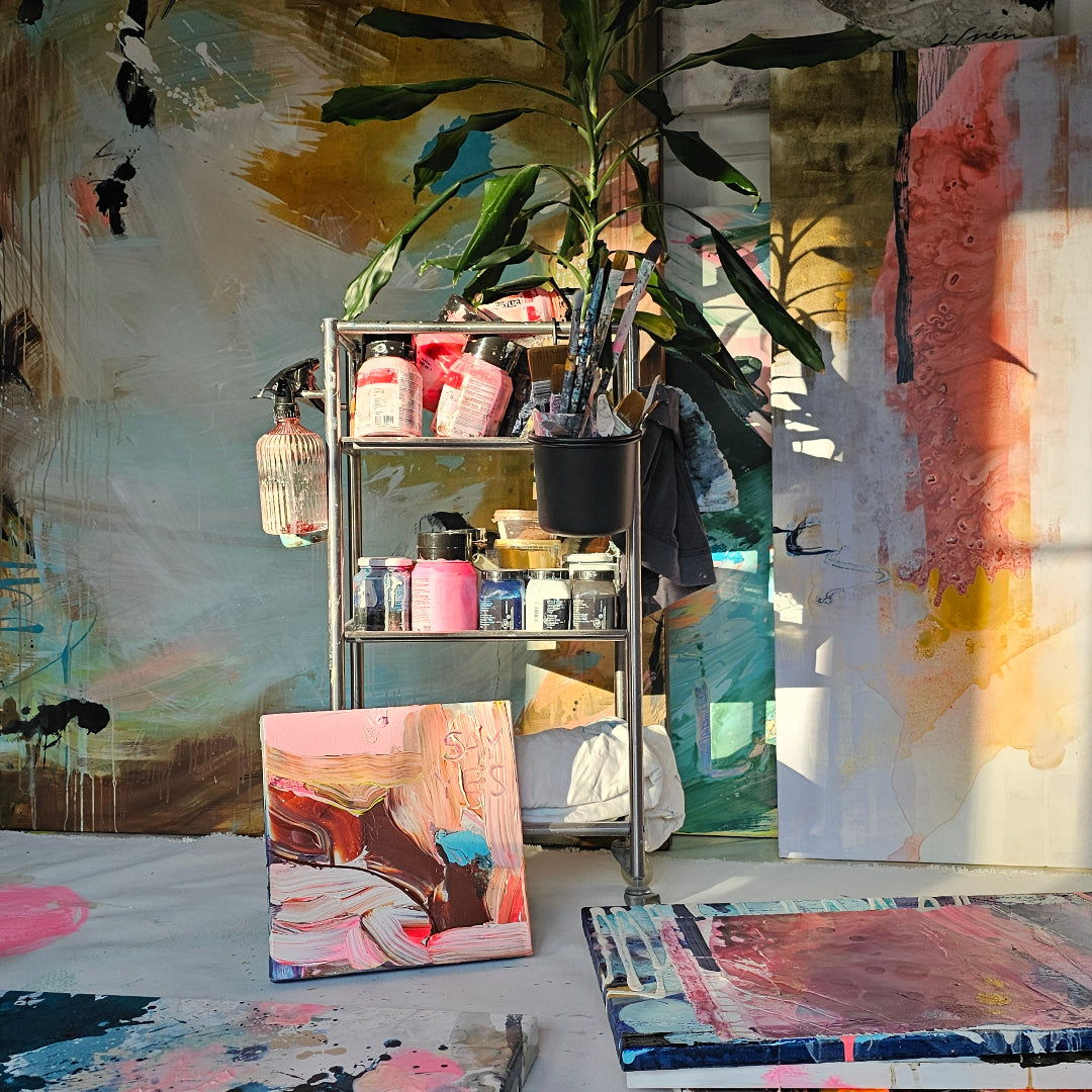 Lotta Sirén's art studio with various paintings and art supplies