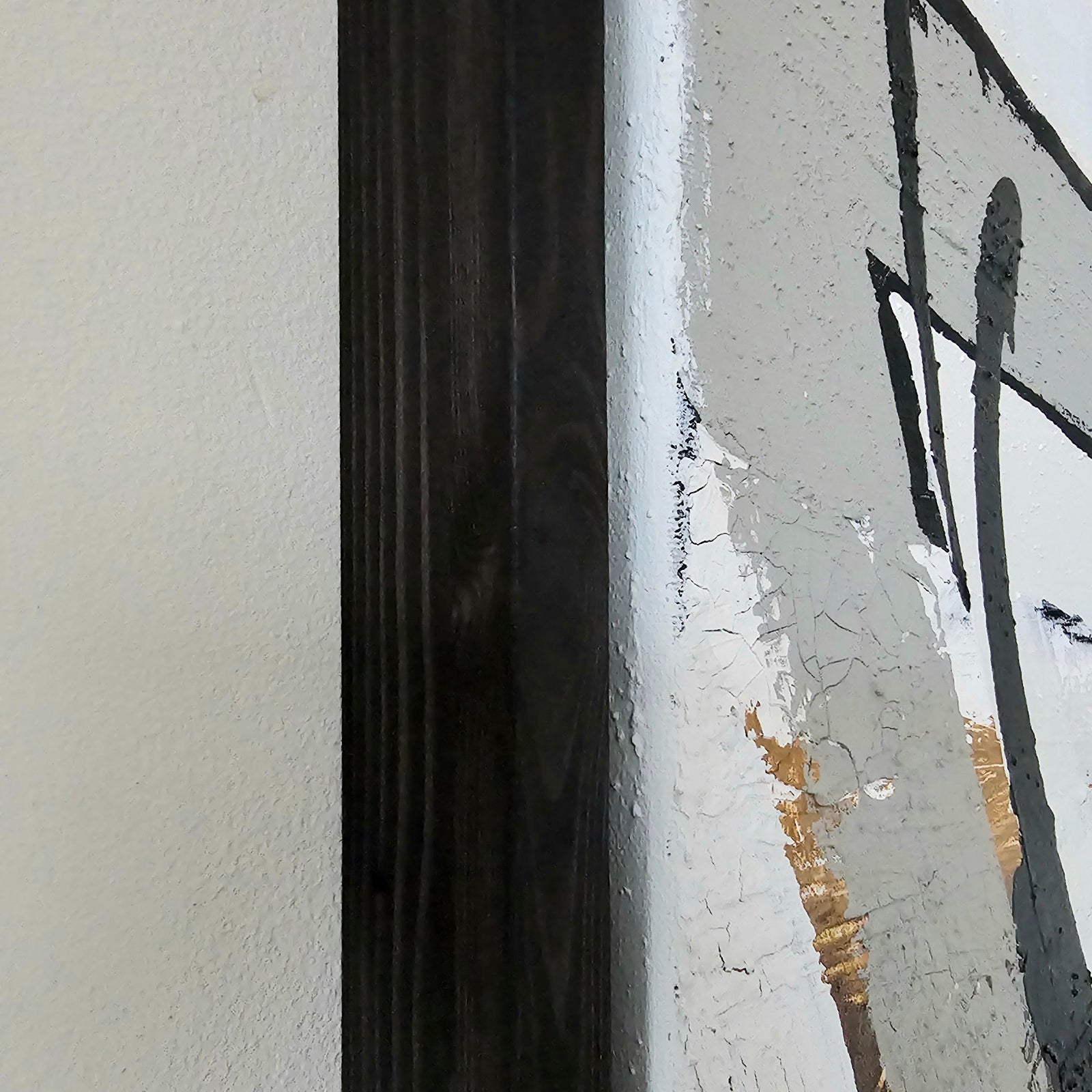 Close-up of an empowering abstract painting by Lotta Sirén with black frame.