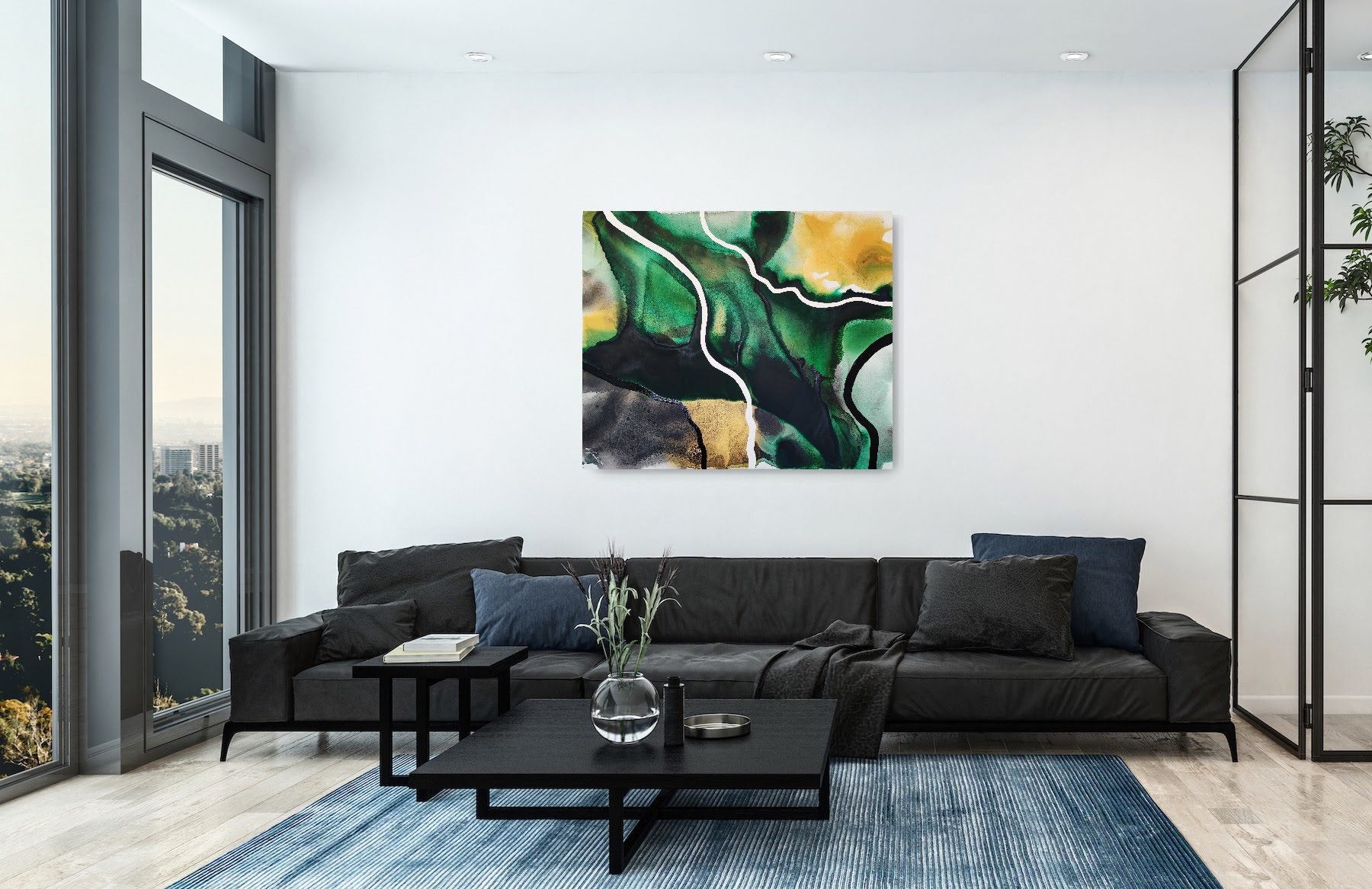 Modern living room with a black sectional sofa, coffee table, and empowering abstract art by Lotta Sirén  on the wall.