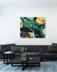 Modern living room with a black sectional sofa, coffee table, and empowering abstract art by Lotta Sirén  on the wall.