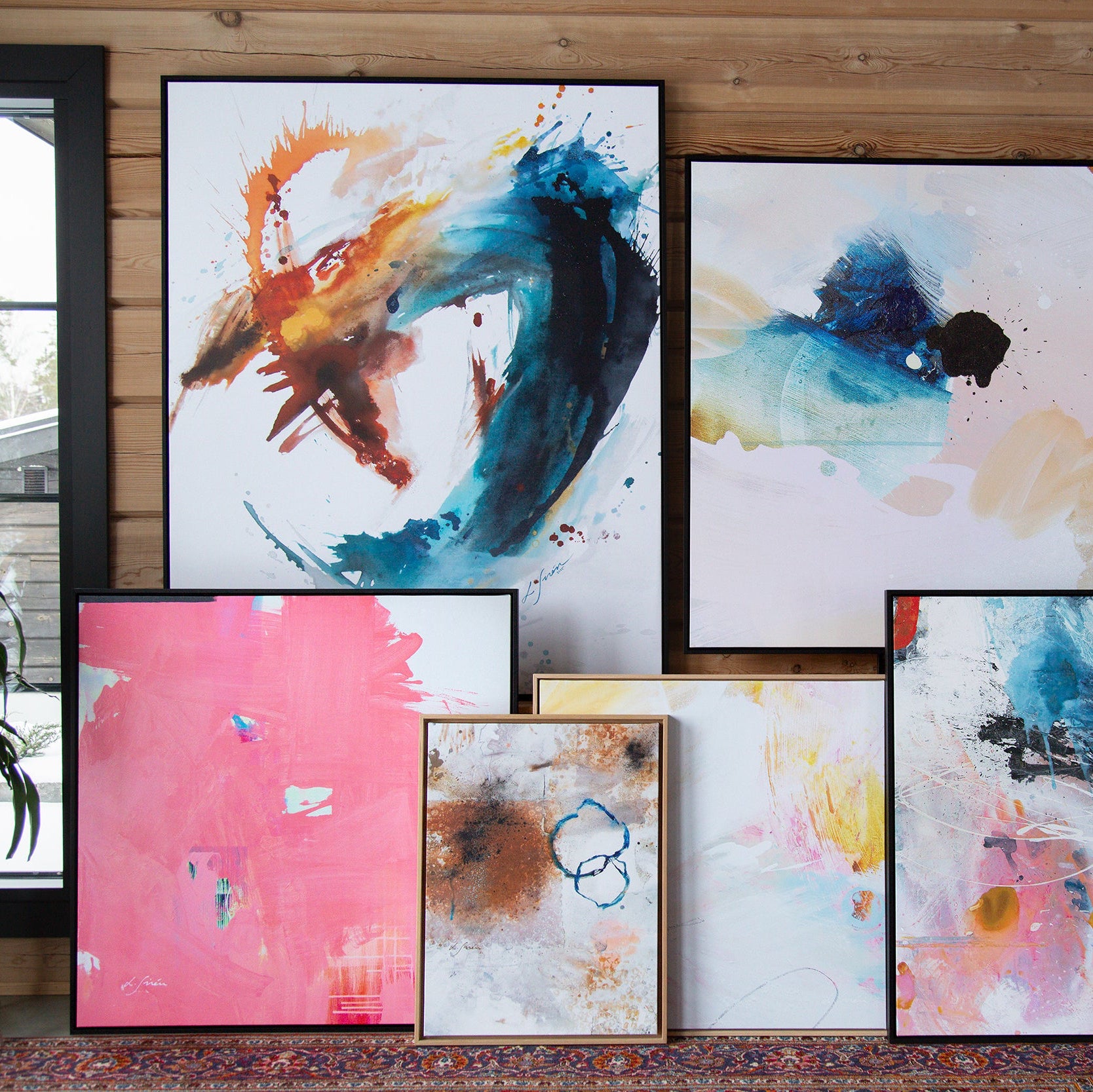 I Don't Like Pink Limited Edition Canvas Print with black frames with cluster of colorful canvas prints from Lotta Sirén