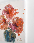 A semi-abstract painting of flowers in a vase with splashes of red, pink, and blue on a white background by finnish artist Lotta Sirén