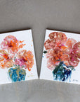Two semi-abstract floral paintings on a textured surface