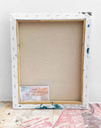 A backside of a semi-abstract painting by Lotta Sirén