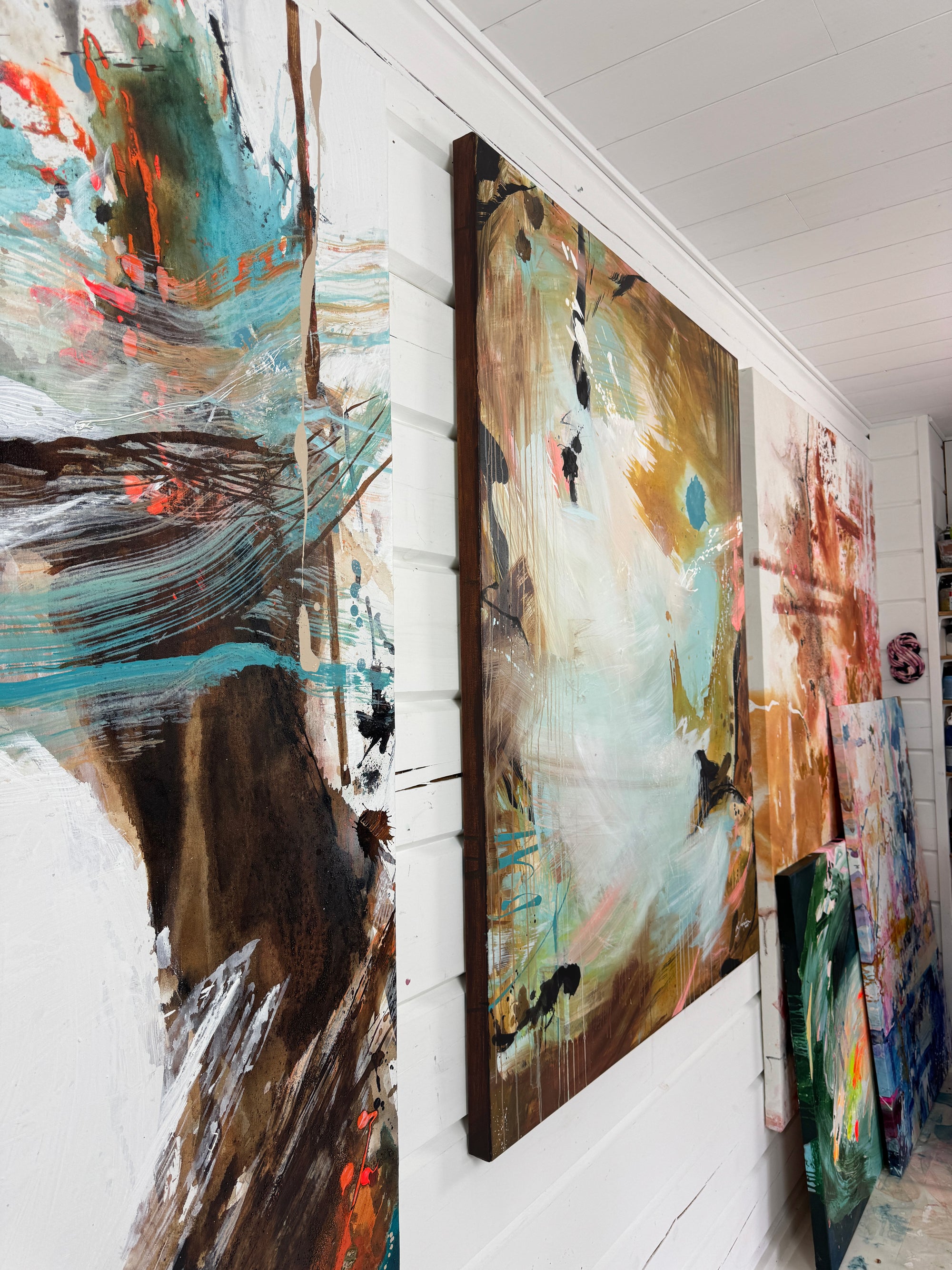 Abstract paintings on a wall in Lotta Sirén ateljee