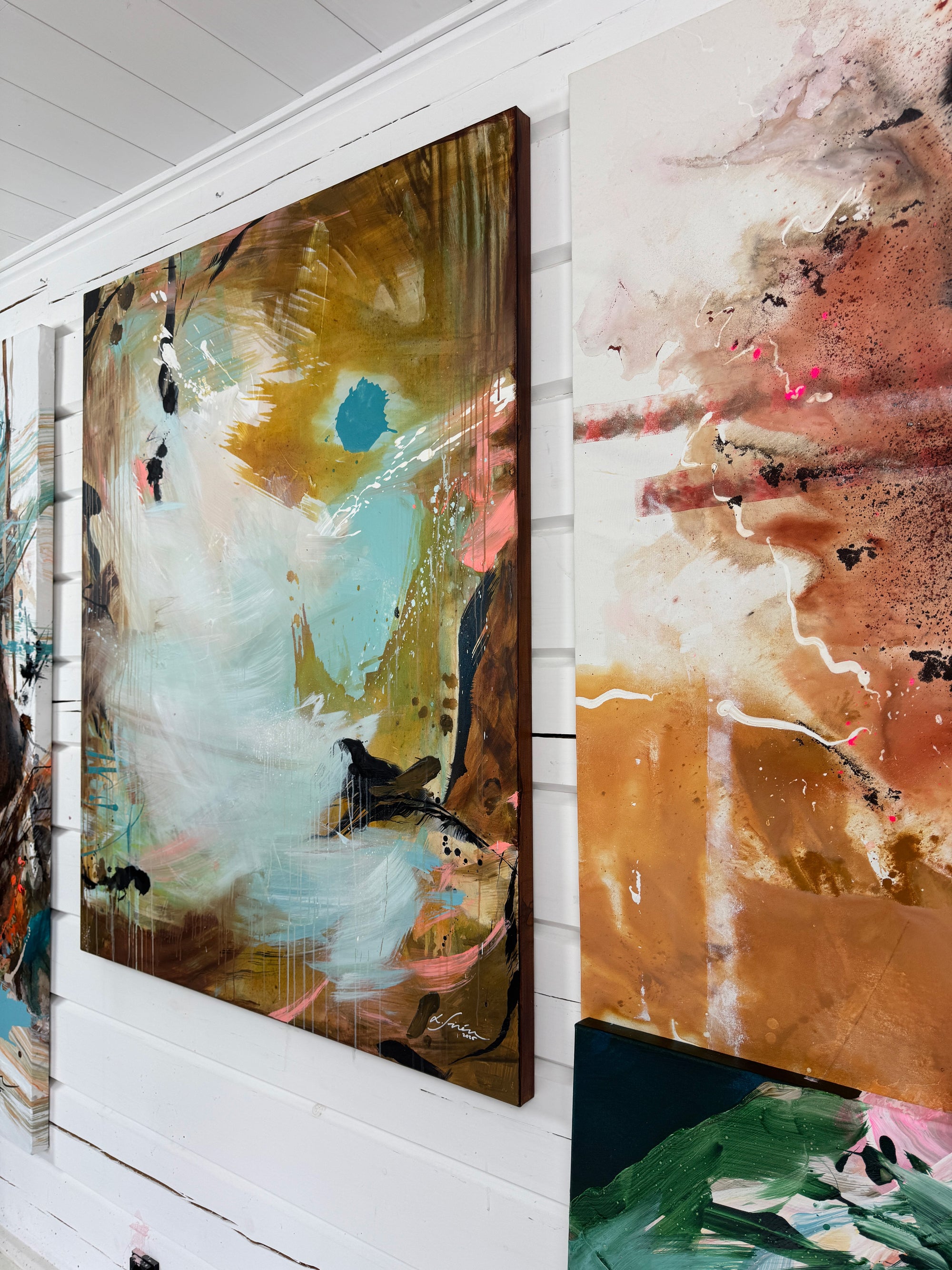 Abstract paintings on a white wall
