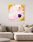 Free - Limited Edition Canvas Print with bold strokes, ocher, white and pink tones and an accent of blue. Abstract canvas print with white frame above a couch.