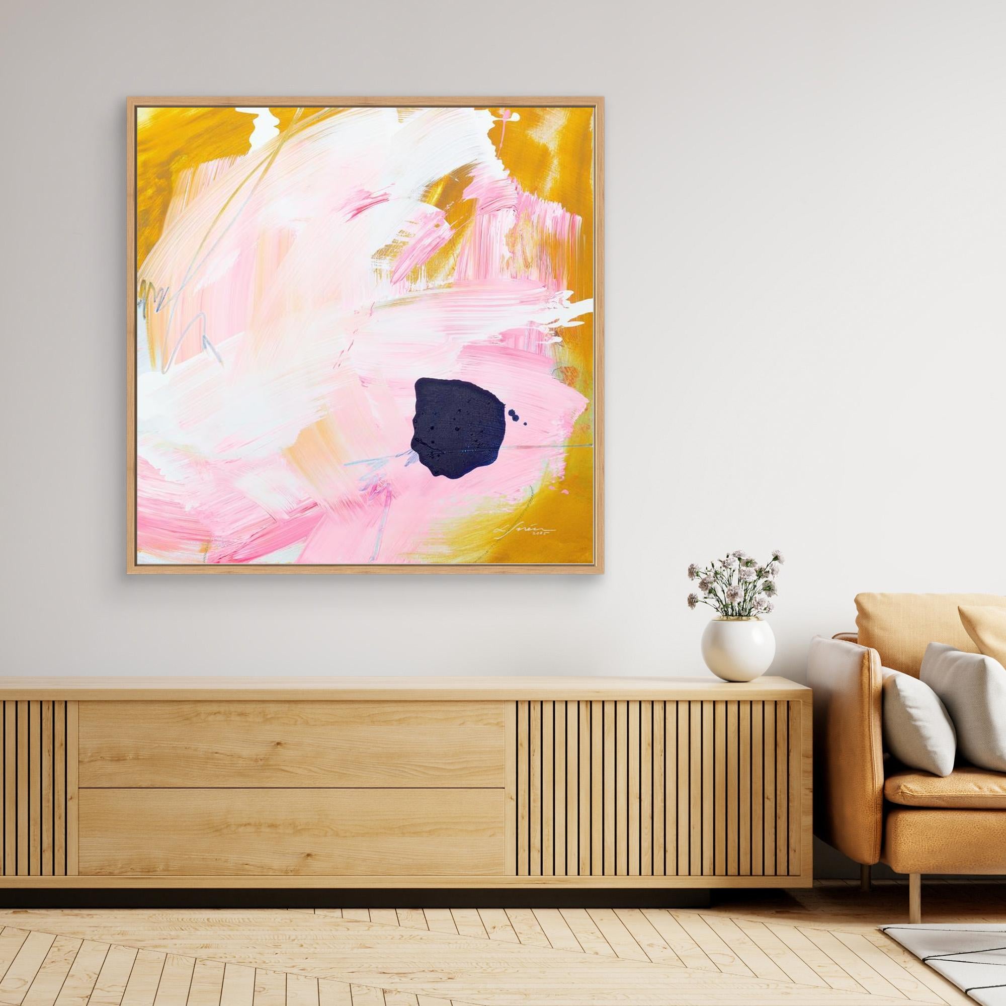 Free - Limited Edition Canvas Print with bold strokes, ocher, white and pink tones and an accent of blue. Abstract canvas print with oak frames above a TV stand. 