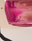Colorful abstract painting of a translucent magenta-pink glass on a warm beige canvas background, with a black brushstroke at the bottom left.