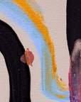 Close-up of an abstract canvas painting showing thick textured brushstrokes in light blue, bright orange, black, and pinkish-red on a warm off-white background.
