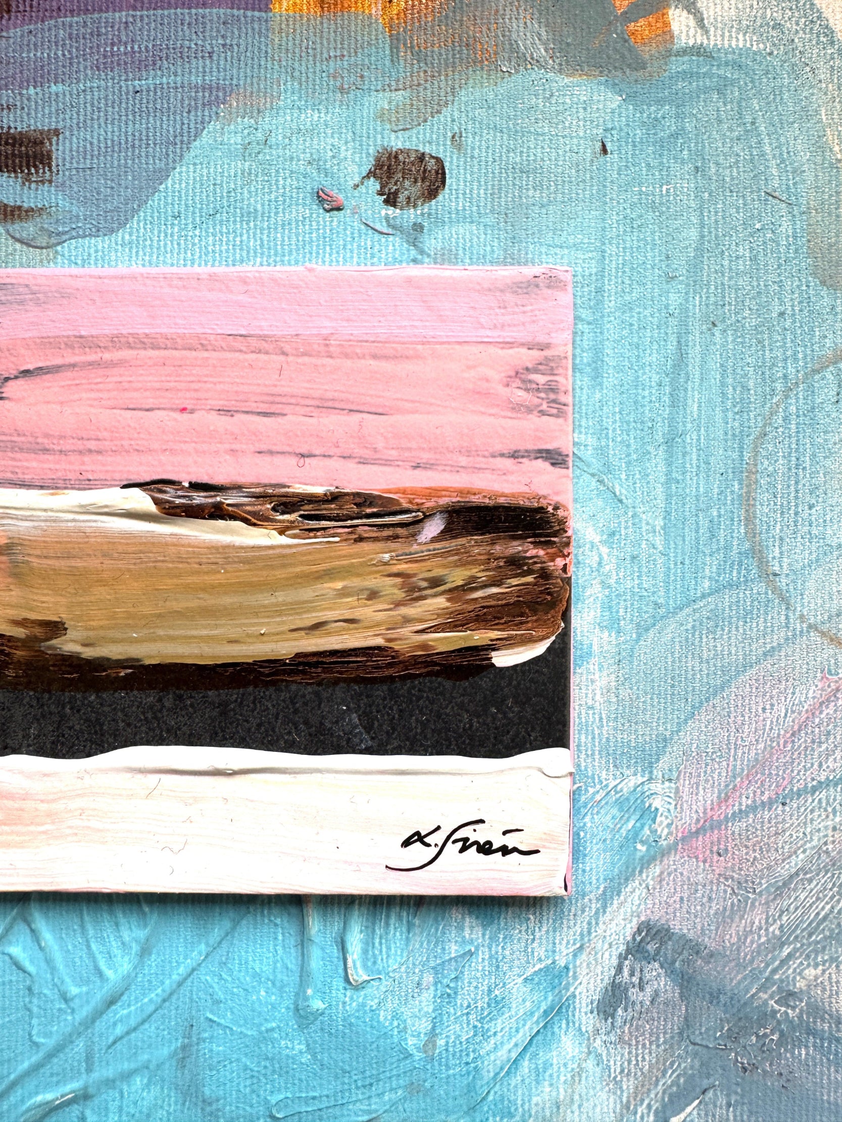 Abstract painting with pink, brown, and blue strokes on a textured surface.