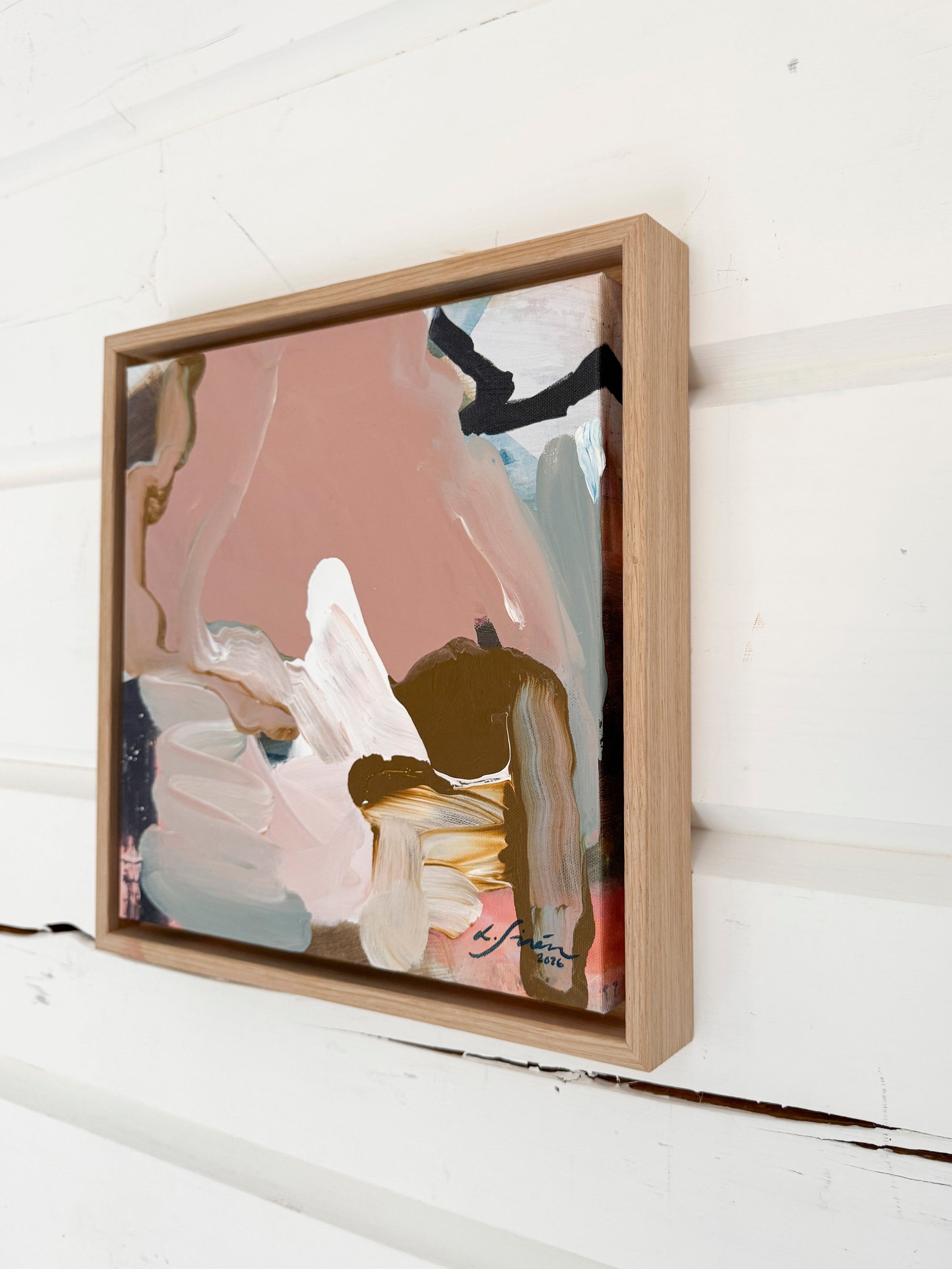 An abstract artwork by Finnish artist Lotta Sirén on a wooden wall