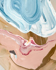 Abstract art with blue, pink, and beige colors on a textured surface