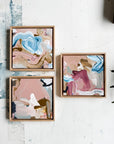 Three abstract art pieces in wooden frames on a white surface by Finnish artist Lotta Sirén