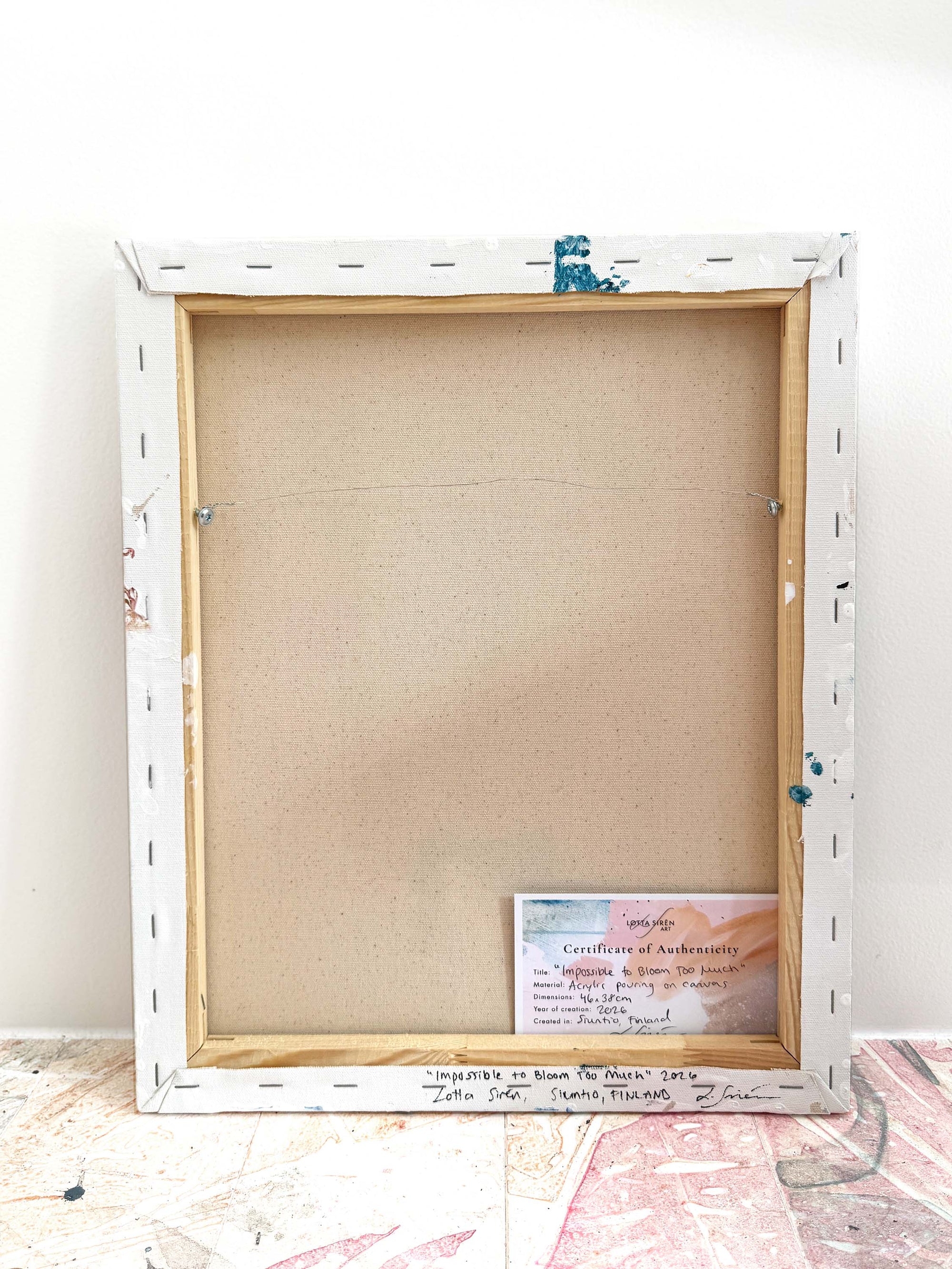 A back of an abstract painting leaning against a wall by abstract artist Lotta Sirén