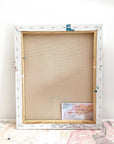 A back of an abstract painting leaning against a wall by abstract artist Lotta Sirén
