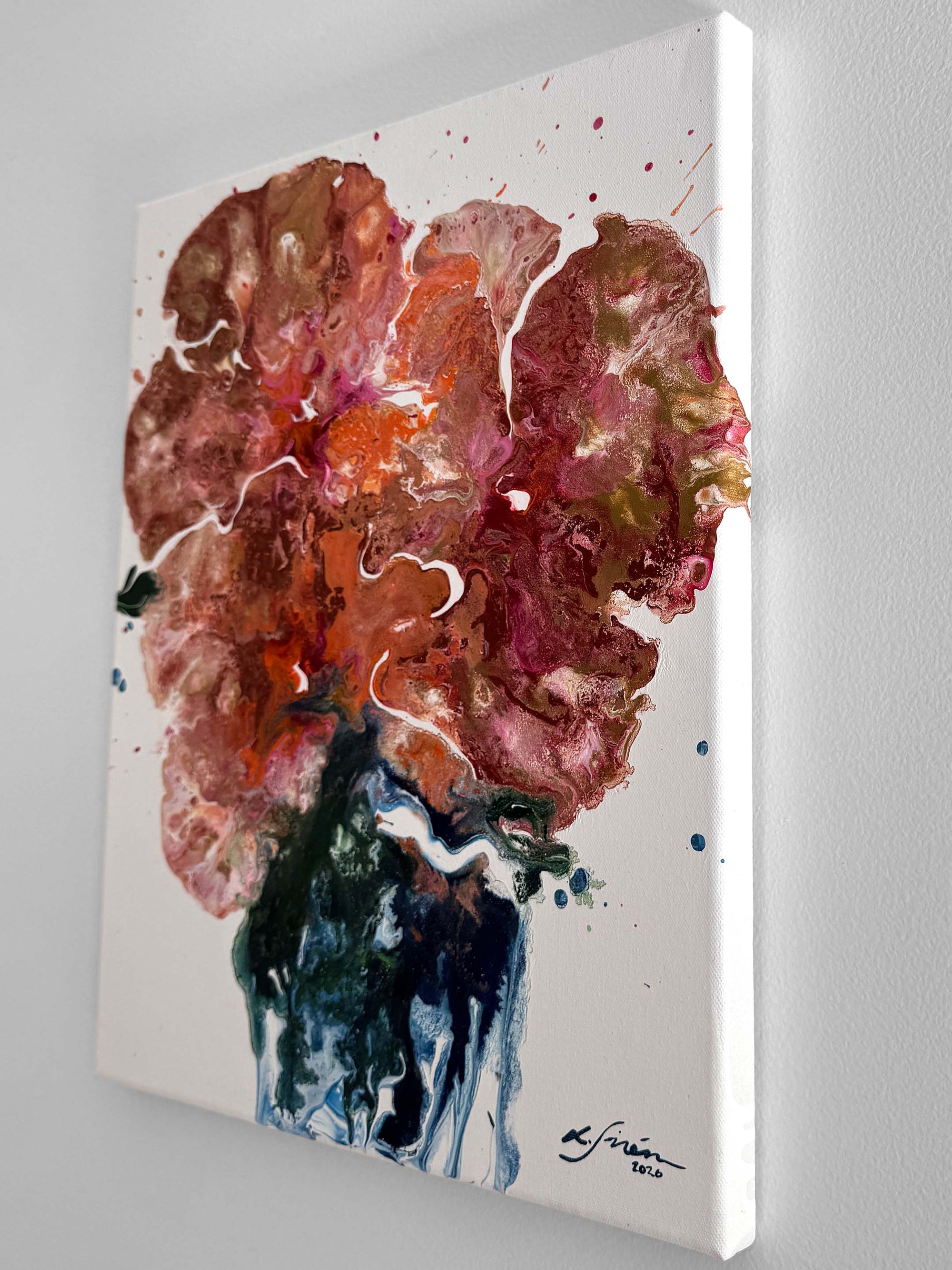 A semi-abstract acrylic painting from a side on a white surface 