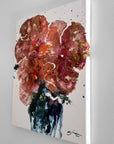 A semi-abstract acrylic painting from a side on a white surface 