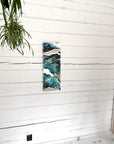 Tall vertical abstract painting on a white wooden wall with a plant by Finnish artist Lotta Sirén