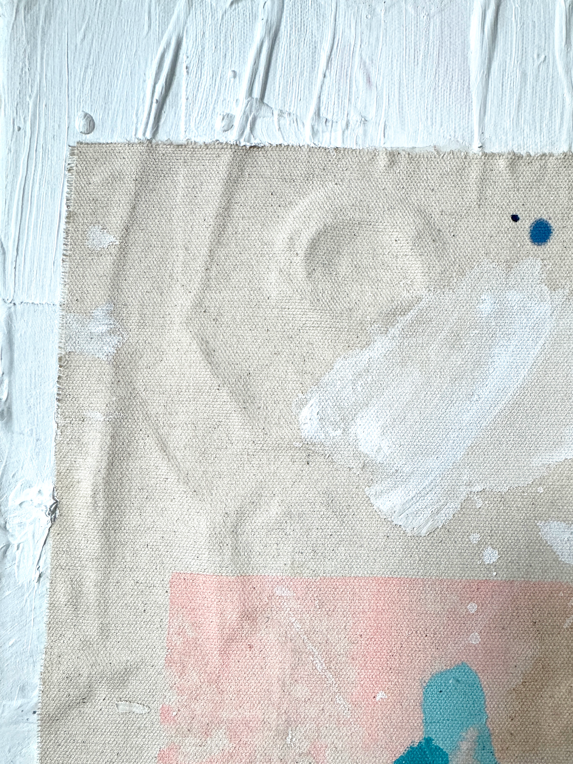 Textured fabric with paint strokes on a light blue background