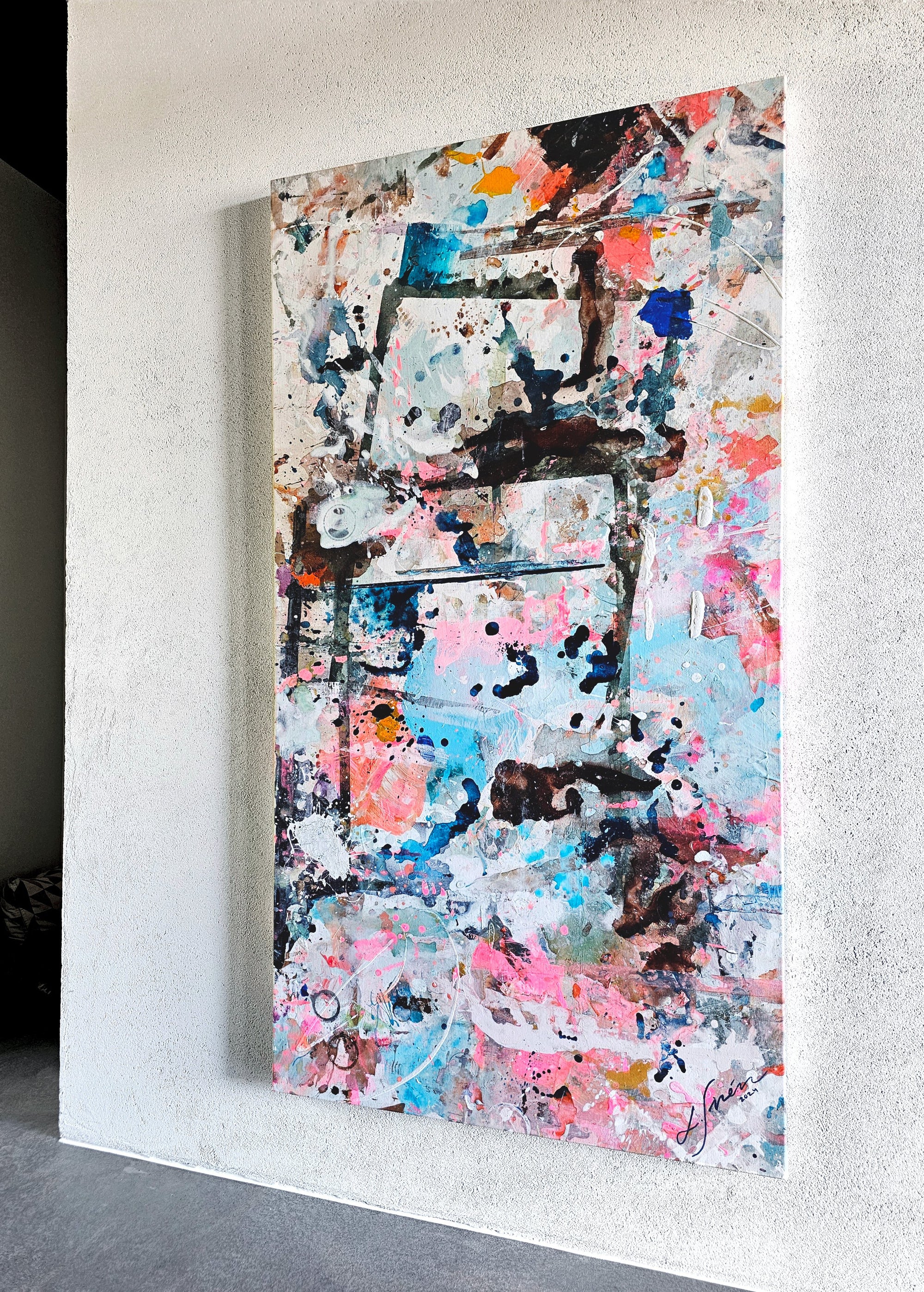 Original abstract painting on a white wall.