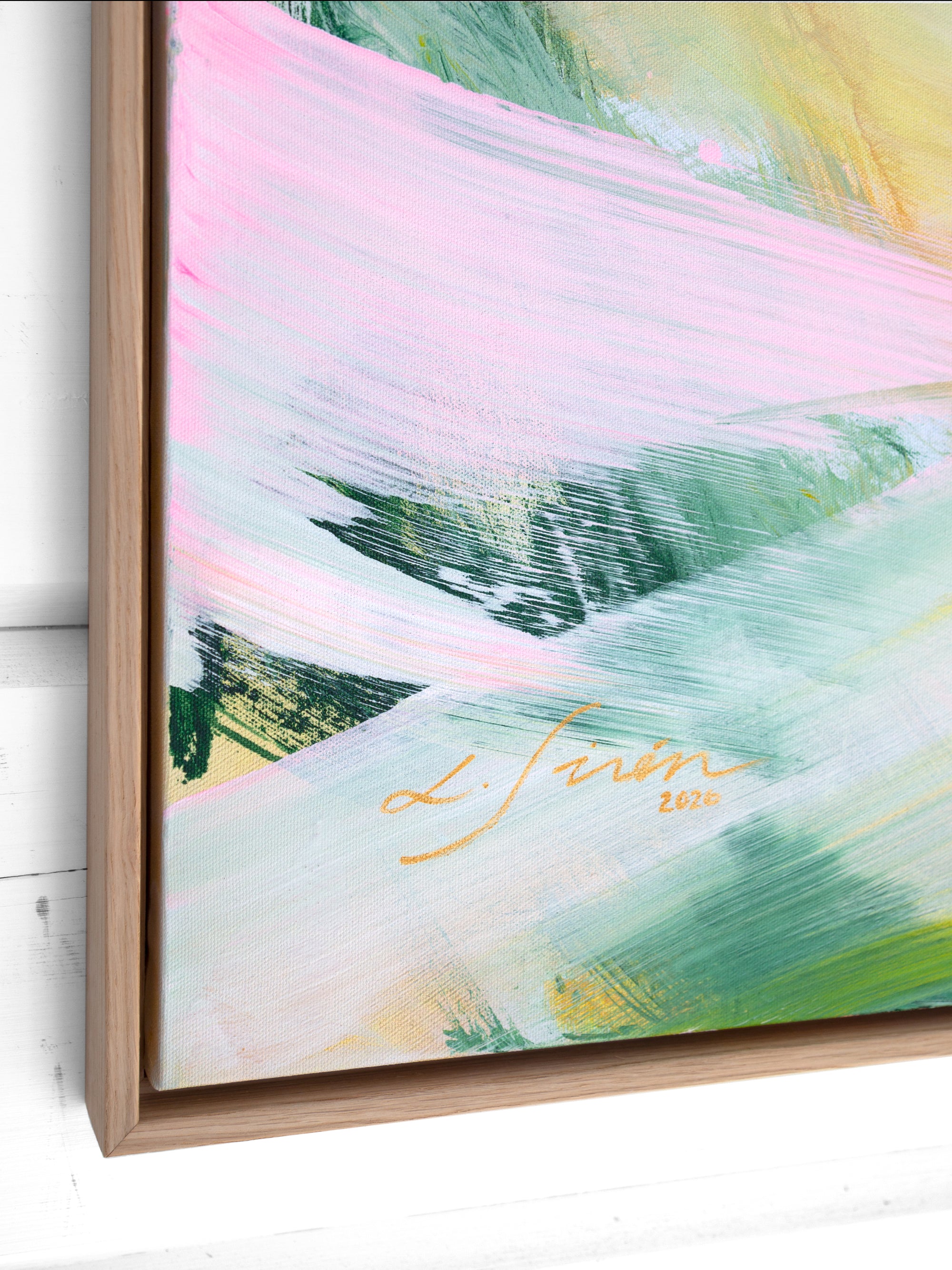 Abstract painting with colorful brush strokes and a signature on a white wall.