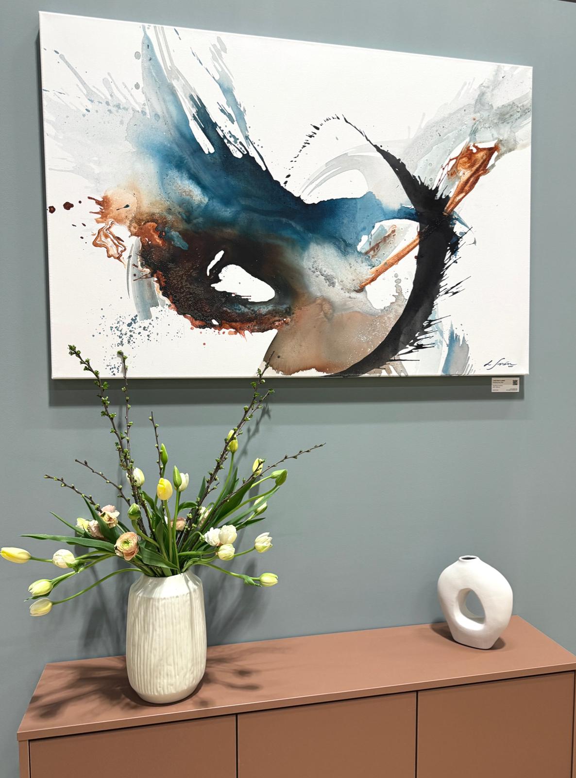 Abstract artwork by Lotta Sirén on a blue wall