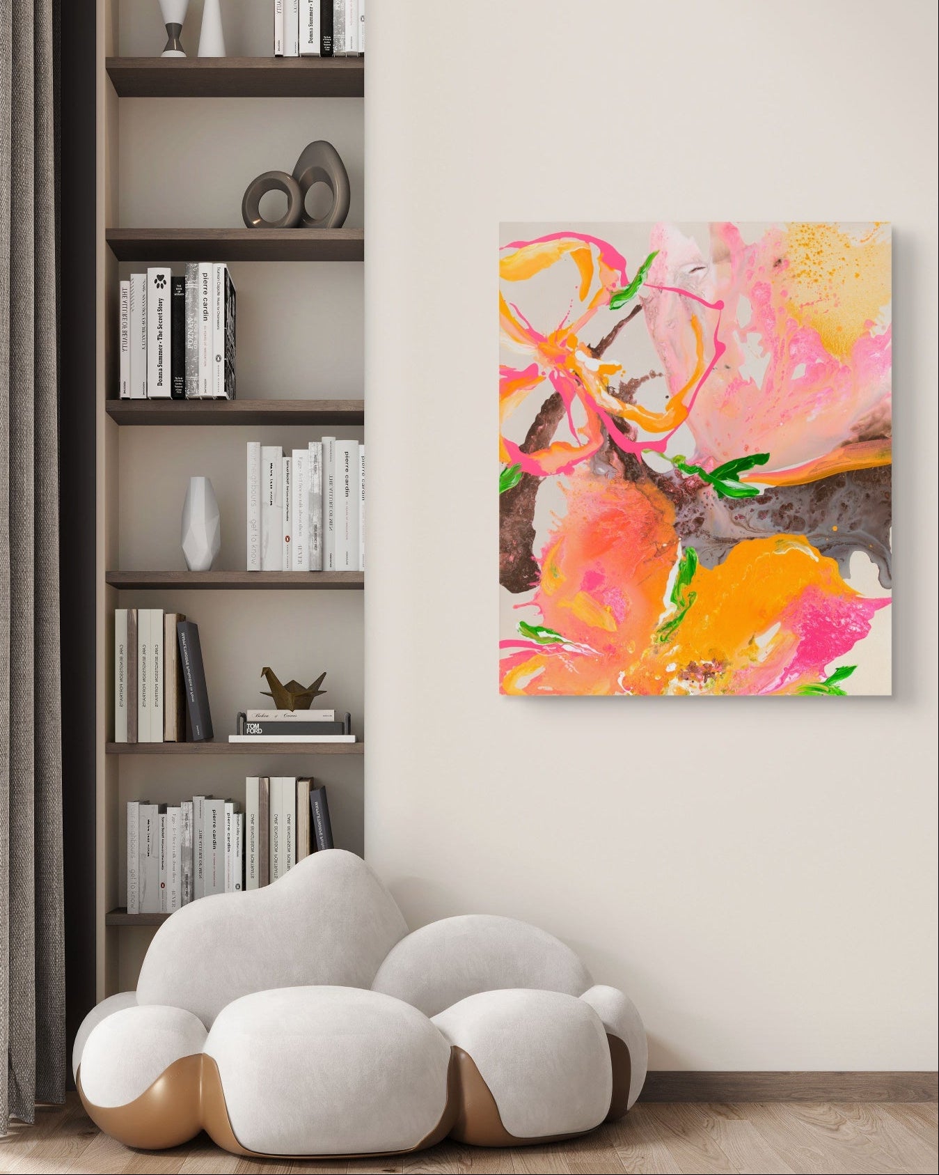 Abstract floral canvas wall art in vibrant pink, orange, and yellow tones, displayed on a light beige wall in a modern living room setting next to a built-in bookshelf and white sofa.