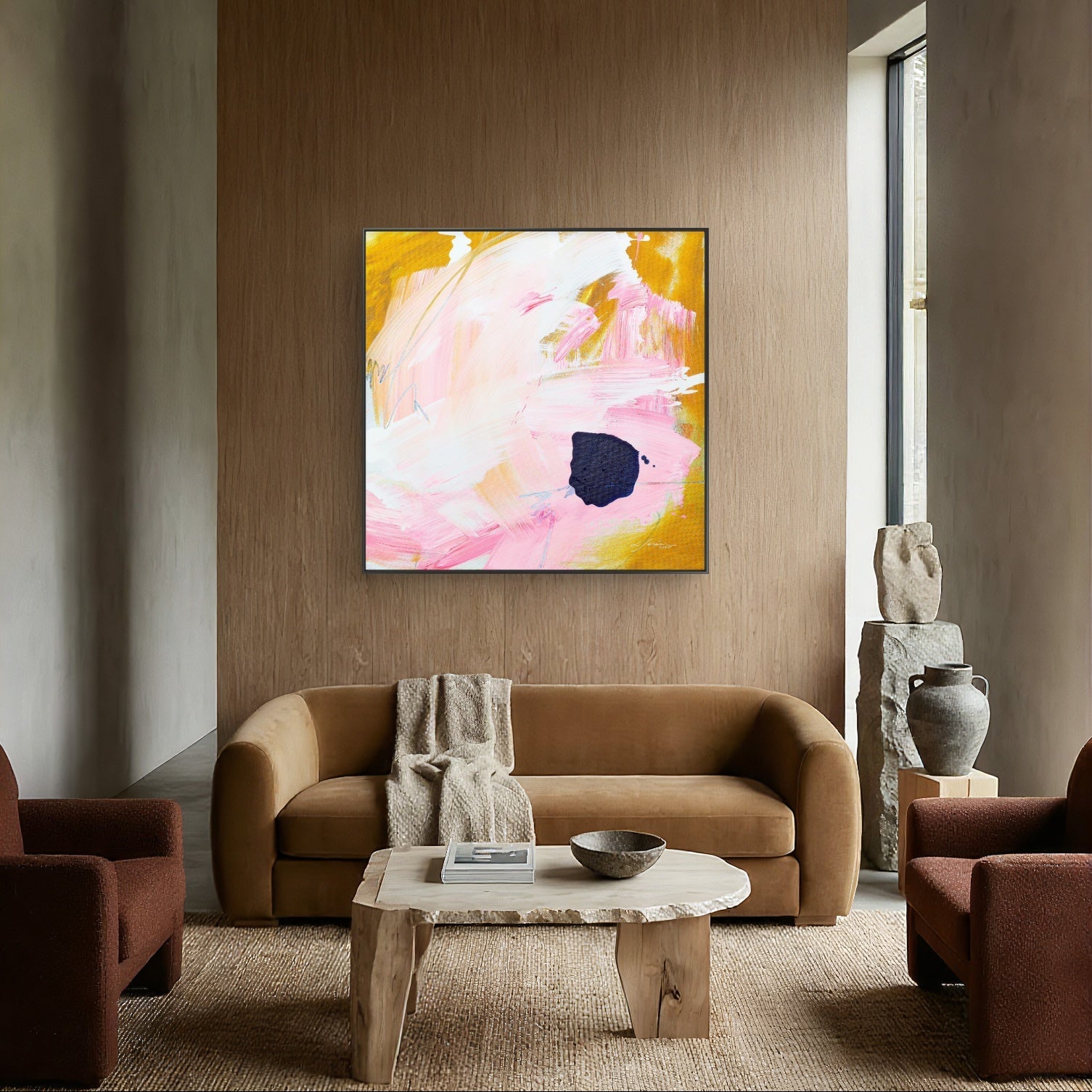 Living room with a brown sofa, coffee table, and yellow abstract painting on a wooden wall.