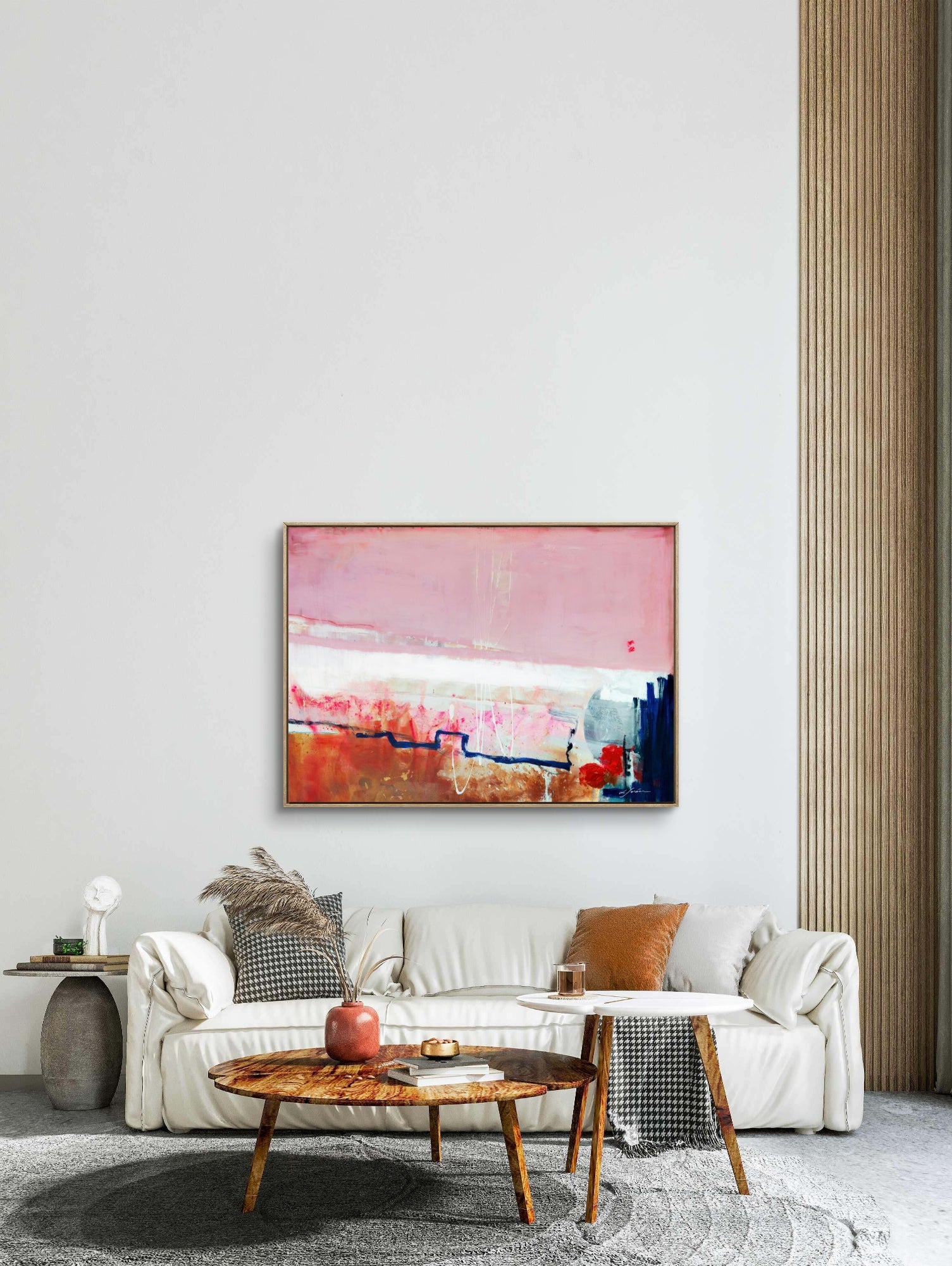 Detours Approved - Limited Edition Canvas Print with oak frames on a living room wall above a tv stand.  Piece with pink, white and burnt sienna tones and a hint of red &amp; blue.  Modern living room with a white sofa, wooden coffee table, and abstract art on the wall.