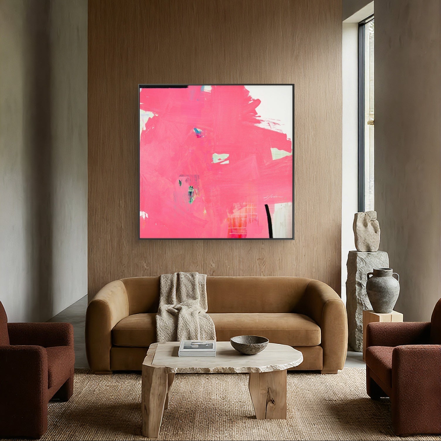 Modern living room with a pink abstract painting on a wooden wall.